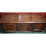 A 17th century style oak low side cabinet, styled as a blanket chest,