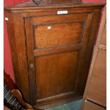 A 19th century oak wall hanging corner cupboard,