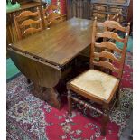 An oak trestle type dining table, stadium shaped top with fall leaves,