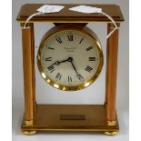 A brass portico clock, by Garrard & Co,