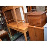 A contemporary light oak effect console table; another, similar; a side cabinet,