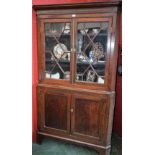 A 19th century oak corner display cabinet,