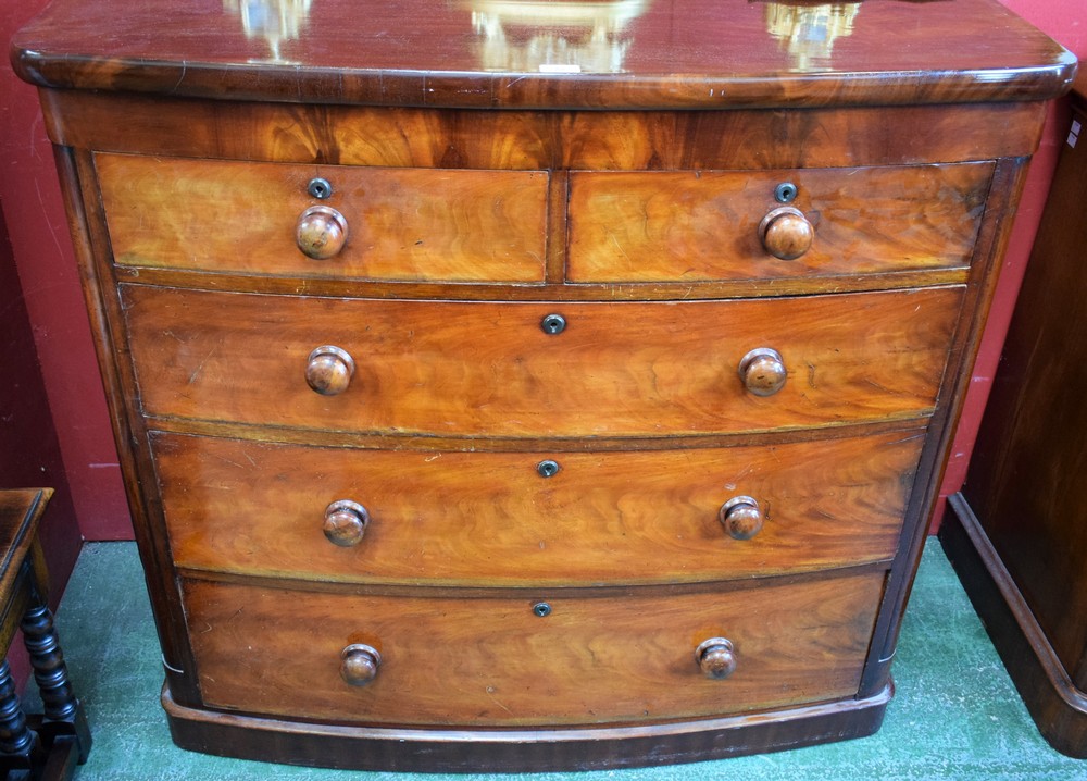 A Victorian mahogany bow fronted chest of two short over three long graduated drawers, plinth base,