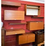 A mid-20th century teak octofurcated floating cabinet, comprising shelves, drawers, open bookcase,