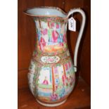 A mid 19th century Famille Rose jug, decorated with courtly scenes and fanciful birds,