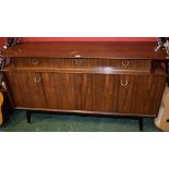 A retro mid 20th century G-Plan sideboard, rounded rectangular top above three short drawers,