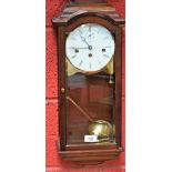 A mahogany Keininger wall clock, brass mounted circular dial with Roman numerals, minute track,