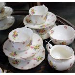 A Royal Doulton floral part tea set, pattern no 4401, comprising cups, saucers, milk jug,