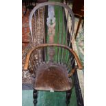 A Country House Windsor elbow chair, shaped pierced splat, turned arm supports, elm saddle seat,