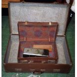 A brown suitcase; another smaller; a papier mache glove box;