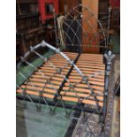 A Gothic style metal bed frame,