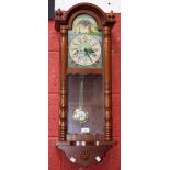 A nautical themed wall clock, arched dial decorated with sailing vessels,