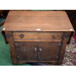 An Arts and Crafts style oak side cabinet,