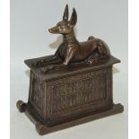 A tourist resin model of Anubis on a tomb ***PLEASE NOTE THERE IS NO BUYER'S PREMIUM ON THIS LOT,