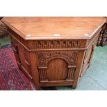 An oak credence type chest, hinged top above a nulled frieze, architecturally applied panels, 92.