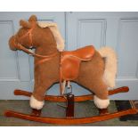 A stuffed fabric rocking horse, wooden cradle,