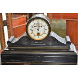 A Victorian slate mantel clock, the circular dial with Roman numerals, minute track,