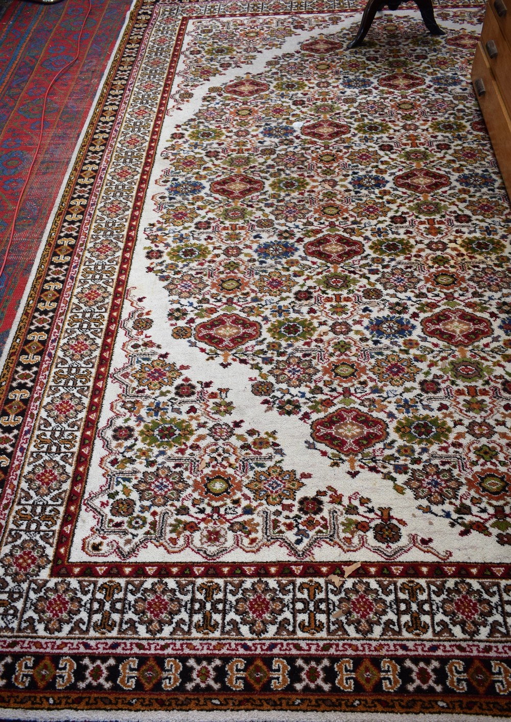 An Axminster Brixham carpet/rug, woven throughout with stylised flowers,