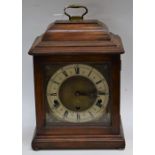 A 20th century Elliott mahogany mantel clock, Roman numerals, three winding holes,