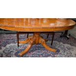 A Victorian style dining table, elliptical top with moulded egg and dart border above a deep frieze,