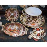 A Royal Crown Derby 2451 pattern trinket dish, first quality; a similar cup and saucer,