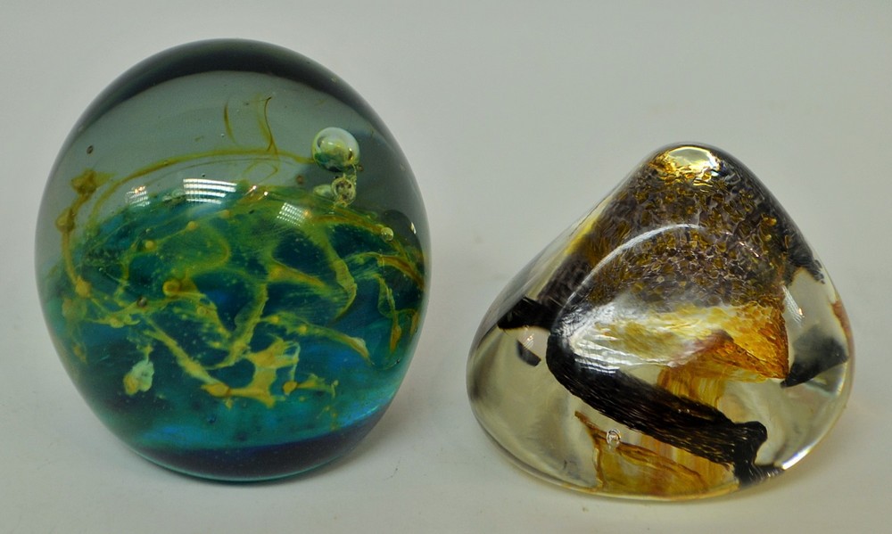 A Mdina glass paperweight;