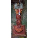 A carved wood columnar lamp base,