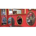 Mirrors - a mid 20th century bevelled polygon wall mirror; a Rococo style oval wall mirror,