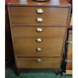 A retro mid 20th century G-Plan chest of six drawers, brass hooded cup handles,