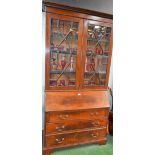 A George III style mahogany bureau bookcase,