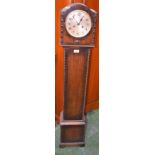 A 20th century oak cased floor standing clock, 135.