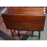 An early 20th century mahogany Sutherland table, rectangular top with fall leaves,