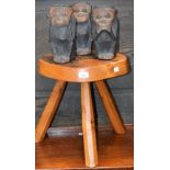 A novelty set of three carved hardwood wise monkies, See No Evil,