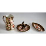 A Royal Crown Derby 2417 pattern cream jug; a Royal Crown Derby 2649 pattern ring stand;