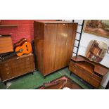 A retro mid 20th century G-Plan three piece bedroom suite, comprising wardrobe,