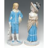 A pair of French figures, of an 18th century gentleman and his companion, standing,