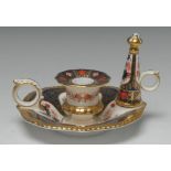 A Royal Crown Derby Old Imari 1128 pattern chamber stick and snuffer, 15cm diam, printed mark,