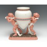 A Mintons centerpiece, modelled with two scantily clad cherubs carrying an oversize amphora,