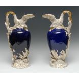 A pair of early 19th century English porcelain ewers, of Sèvres vase cygne à roseau en buire shape,