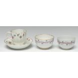 A Chelsea Derby fluted coffee cup and saucer, decorated with floral swags and foliage,