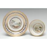 A Derby tea bowl and saucer, painted by Zachariah Boreman with figures in a river landscape,