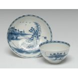 A Worcester Rock Strata Island pattern tea bowl and saucer, printed with cottage, window,