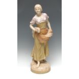 A Royal Dux figure, of a lady holding corn in her aprons and under her arm, in burnished gilt,