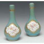 A pair of English porcelain Sèvres style bottle vases and covers,