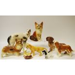 A Beswick Chihuahua on cushion; a Beswick Spaniel; a Beswick lion cub;