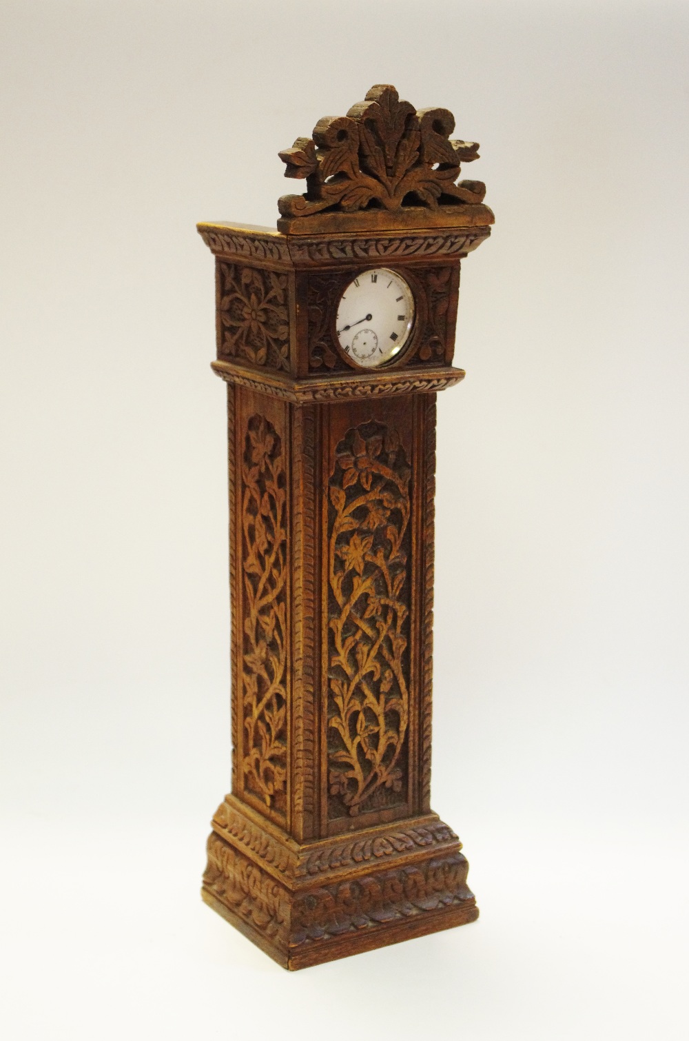 A late Victorian oak novelty pocket watch stand in the form of a longcase,
