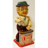 Breweryana - a novelty 1950's 'Charley Weaver' battery operated tin plated bar tender toy that