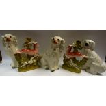 A pair of Victorian Staffordshire mantel dogs, 31cm high, c.