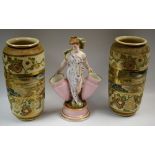 A 19th century German porcelain table centre, as a female beauty, 27.