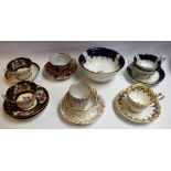A Barr Flight Barr Imari palette tea cup and saucer; a Derby spirally fluted tea cup and saucer;
